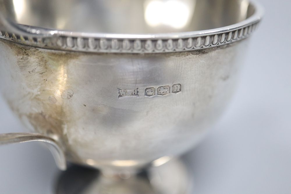 A George V silver pedestal cream jug, Walker & Hall, Sheffield, 1930, 85mm,